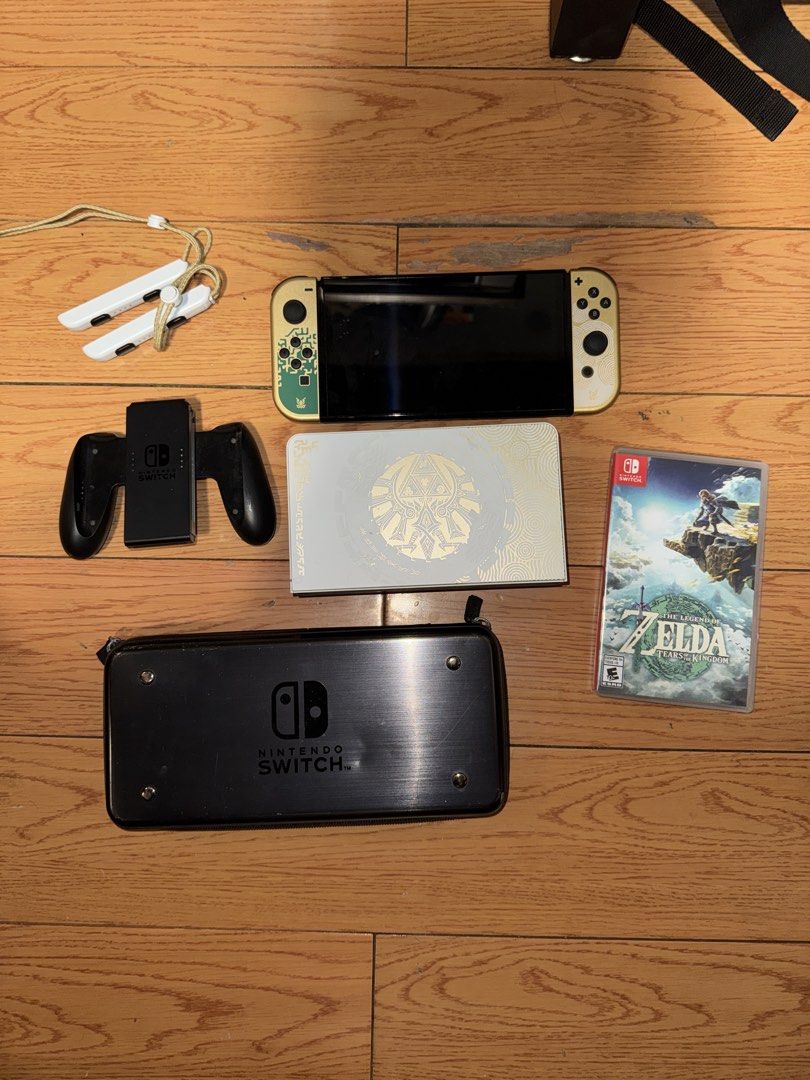 Nintendo Switch OLED Zelda Edition (Category: Nintendo) located in Manila. Submitted by andr29951 (Listing ID 1435771058, Image 1). Description: - Nintendo Switch OLED Zelda Edition console - Matching Joy-Cons -NO BOX - Charging grip included - Carrying case included - "The Legend of Zelda: Tears of the Kingdom" game included - All accessories are present -Free Nintendo 30GB Micro SD Card included.