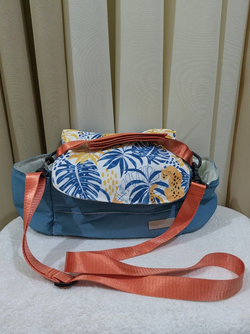 stroller bag organizet with sling (Category: Strollers) located in Makati City. Submitted by prelovedtreatedwithlove (Listing ID 1435832416, Image 1). Description: - Vibrant blue organizer bag - Features a patterned flap - Comes with an orange shoulder strap and handle - Spacious, light-colored interior - Includes tissue holder - Perfect for gateway with kiddo - Normal sign of use need wash A-102.