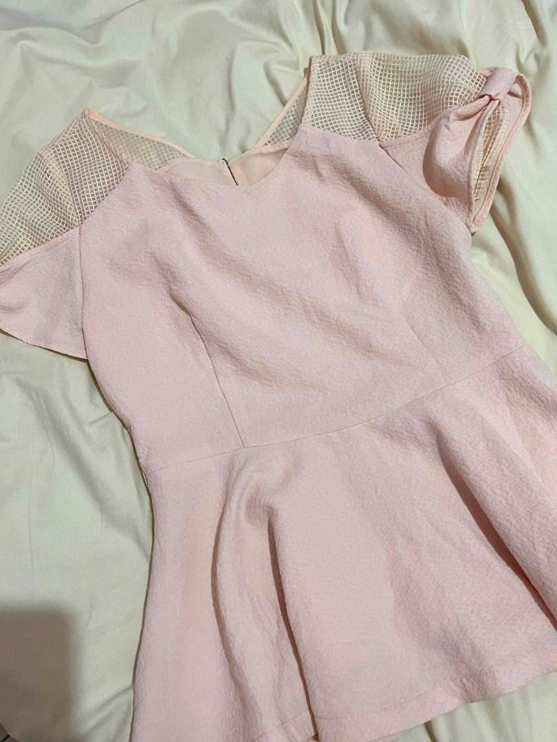 Peach Peplum Top with Mesh Sleeves (Category: Blouses) located in General Santos City (Dadiangas). Submitted by aynleex (Listing ID 1435886280, Image 3). Description: - Peach-colored peplum top - Mesh detailing on shoulders and sleeves - Round neckline - Back zipper closure - Textured fabric - Suitable for various occasions.