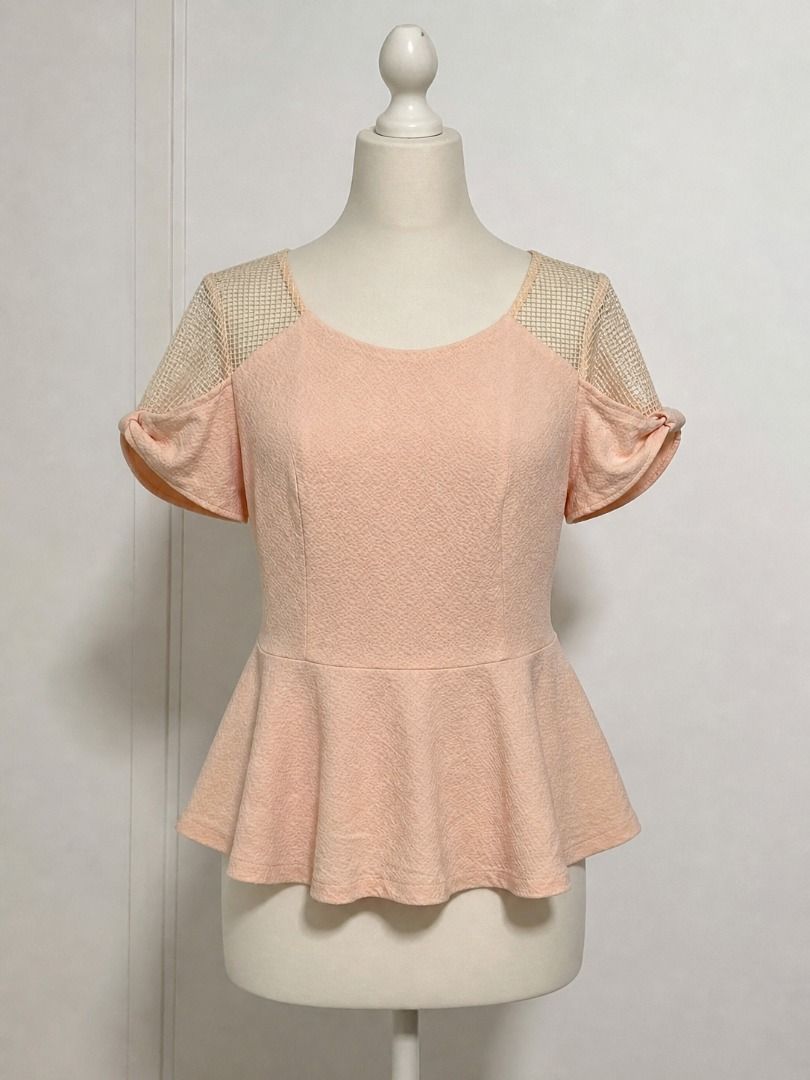Peach Peplum Top with Mesh Sleeves (Category: Blouses) located in General Santos City (Dadiangas). Submitted by aynleex (Listing ID 1435886280, Image 1). Description: - Peach-colored peplum top - Mesh detailing on shoulders and sleeves - Round neckline - Back zipper closure - Textured fabric - Suitable for various occasions.