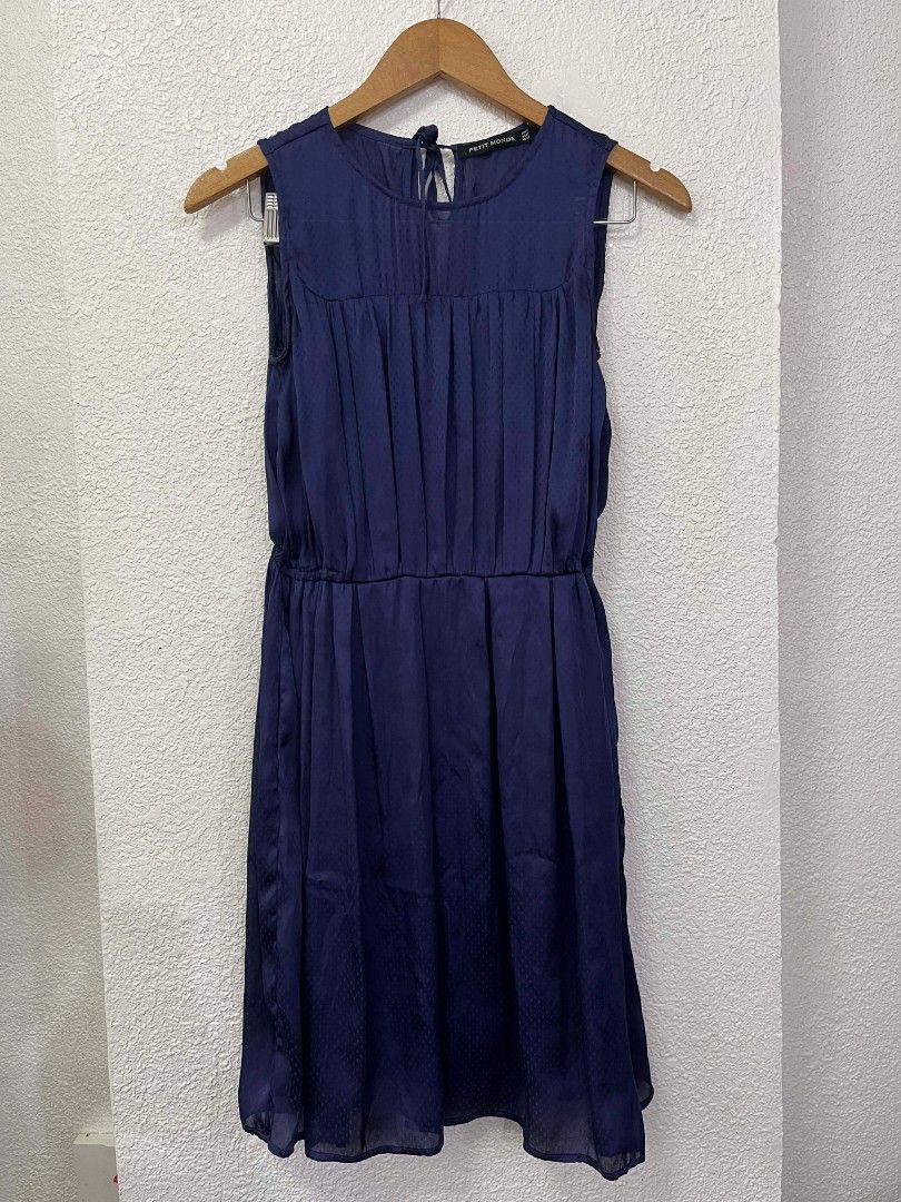 Petit Monde Navy Blue Dress (Category: Dresses) located in Baguio. Submitted by zealfish-f7c3 (Listing ID 1435772856, Image 1). Description: - Navy blue dress from Petit Monde. - Sleeveless design. - Gathered bodice and defined waist. - Subtle textured pattern. - Keyhole back with tie detail. - Knee-length. - Perfect for special occasions and nights out..