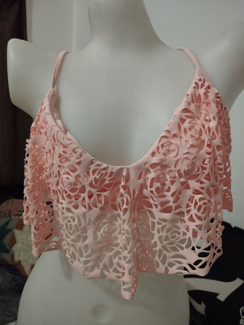 Pink Floral Cutout Bikini Top (Category: Bikinis & Swimsuits) located in Manila. Submitted by beckylafea (Listing ID 1435824854, Image 1). Description: - Pink bikini top - Floral cutout design - Halter neck - Tie back closure freesize - Layered design - Adjustable straps - Perfect for beach or pool.