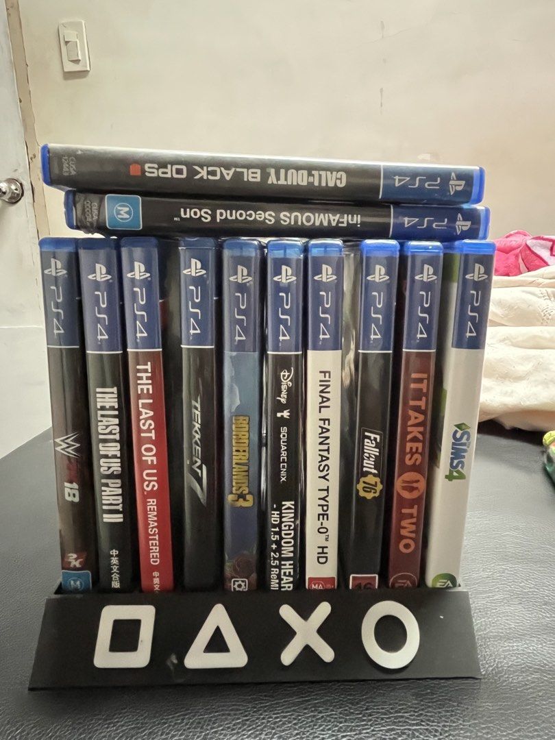 PlayStation 4 Slim with Games and Controllers (Category: PlayStation) located in Quezon City. Submitted by mynglflrnc (Listing ID 1435881144, Image 2). Description: - PlayStation 4 Slim console (black) 1TB - Two black controllers - Game stand included - Games included: - Call of Duty: Black Ops - Infamous Second Son - The Last of Us Part II - Tekken 7 - Borderlands 3 - More games included!.