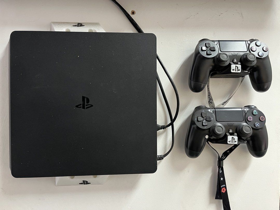 PlayStation 4 Slim with Games and Controllers (Category: PlayStation) located in Quezon City. Submitted by mynglflrnc (Listing ID 1435881144, Image 1). Description: - PlayStation 4 Slim console (black) 1TB - Two black controllers - Game stand included - Games included: - Call of Duty: Black Ops - Infamous Second Son - The Last of Us Part II - Tekken 7 - Borderlands 3 - More games included!.