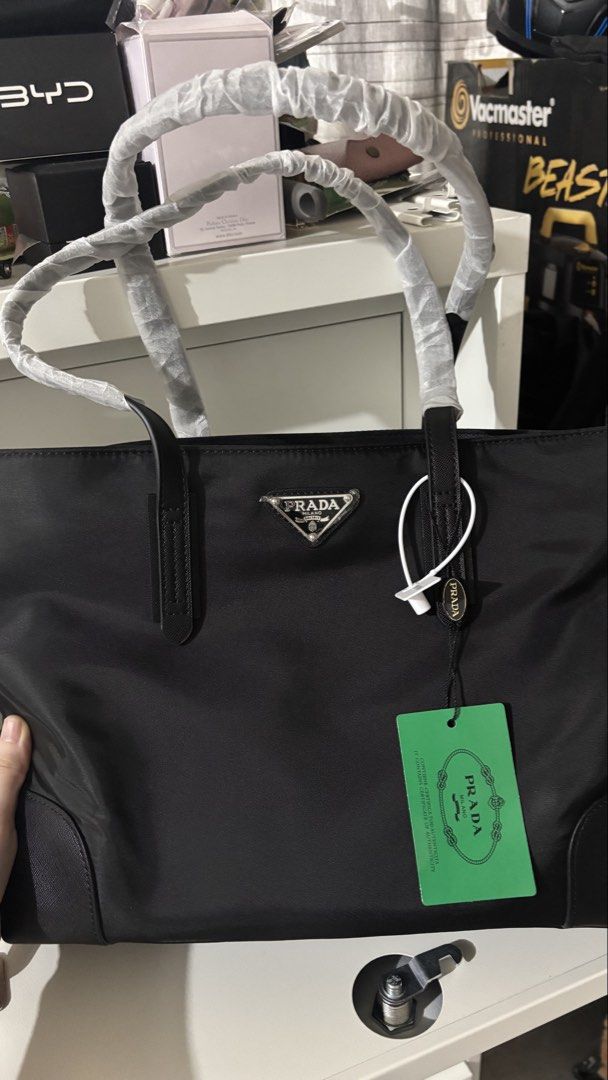 Prada Tote Bag with two small bags (Category: Luxury Bags & Wallets) located in Cavite. Submitted by declutteringthingzz (Listing ID 1435840530, Image 1). Description: Authentic Prada GWP Removed plastics packaging.