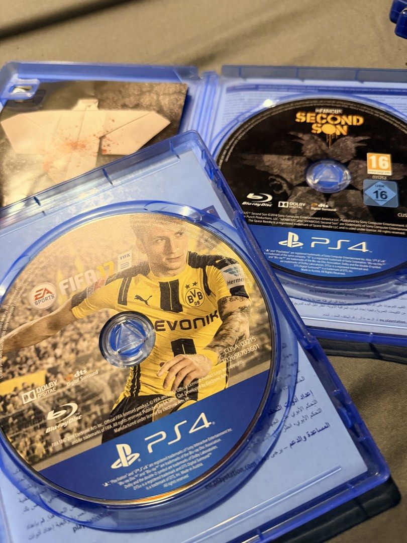 PS4 Games: FIFA 17 and Infamous Second Son (Category: PlayStation) located in Manila. Submitted by acrunny (Listing ID 1435815154, Image 2). Description: - FIFA 17 for PS4: - Original case - Features player in yellow jersey on cover - Infamous Second Son for PS4: - Original case - Features character on cover with orange and black background +SF for Delivery📍.