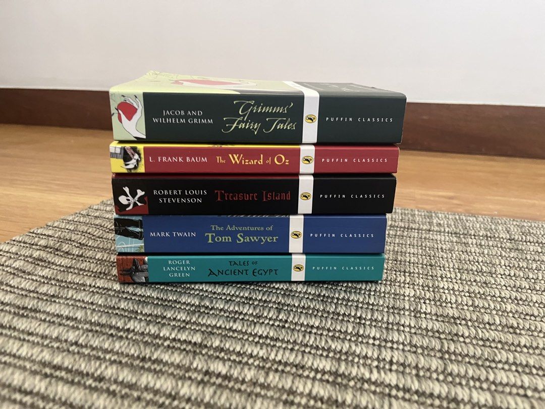 Puffin Classics Children’s Books (Category: Children's Books) located in Muntinlupa City. Submitted by t.immyzee (Listing ID 1435754721, Image 3). Description: 5 Puffin Classics books 150 per book 700 for set Titles Include: - "Treasure Island" - "The Wizard of Oz" - "Grimms' Fairy Tales" - "Tales of Ancient Egypt" - "The Adventures of Tom Sawyer" - Some wear on edges and pages.
