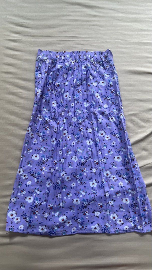 Purple Floral Maxi Skirt (Category: Skirts) located in Paranaque City. Submitted by kianaericka (Listing ID 1435726342, Image 3). Description: - Stunning floral print maxi skirt - Colors: Purple, white, and blue - High-waisted design - Stylish side slit - Made from lightweight fabric - Comfortable elastic waistband - Perfect for warm weather.