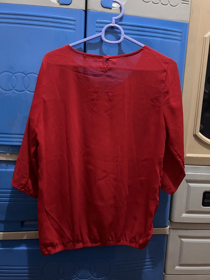 Red 3/4 sleeve blouse (Category: Blouses) located in Manila. Submitted by jovalbarez (Listing ID 1435851605, Image 3). Description: Brand: Krizia Material: cotton chiffon Size: M Color: Red (photo is very vibrant, slightly darker in person) Has garter on bottom. Already in last price. Item is from Santa Lucia, Pasig. Delivery to be shouldered by buyer. Available for Makati meetup on weekdays..