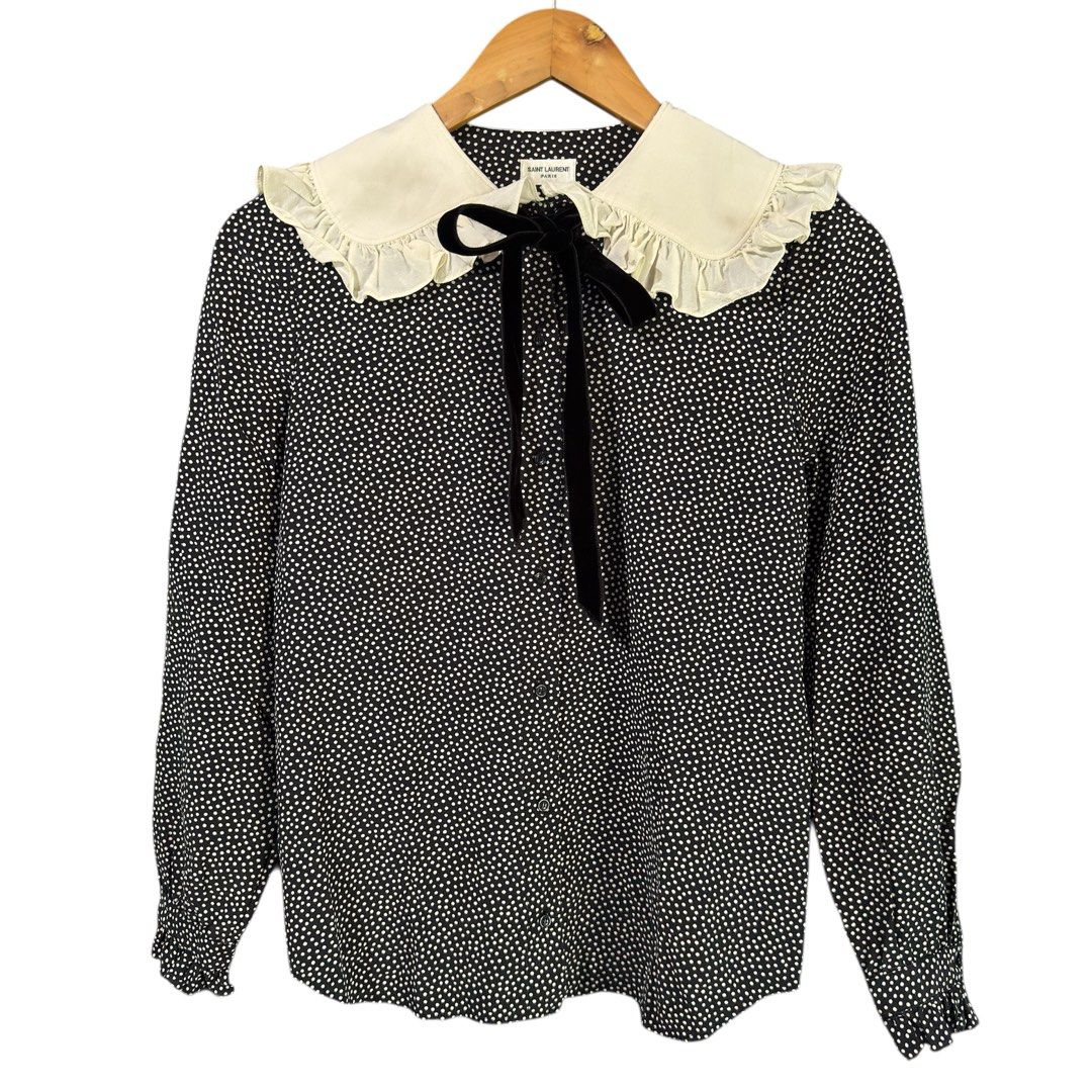 SAINT LAURENT - Peter Pan Collar Polka Blouse (Category: Blouses) located in Cavite. Submitted by gooditems.cavite (Listing ID 1435906001, Image 1). Description: - Saint Laurent blouse - Black and white polka dot pattern - White ruffle collar - Black velvet tie - Ruffled cuffs - Made in Italy - Size: F34, 155/80Y 18.5 width 24 length 14 shoulder 22 sleeves.