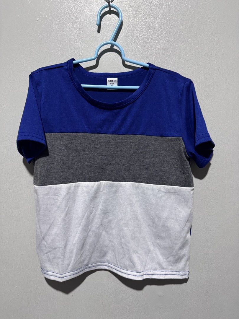 Shein Color Block Top and Pants Set (Category: Babies & Kids Fashion) located in General Trias. Submitted by lessleesell (Listing ID 1435882691, Image 1). Description: - Shein color block outfit - Includes top and matching pants - Top features: - Blue, gray, and white color block design - Pants feature: - Blue with gray and white accents - Made of comfortable fabric - Size is indicated on the tag.
