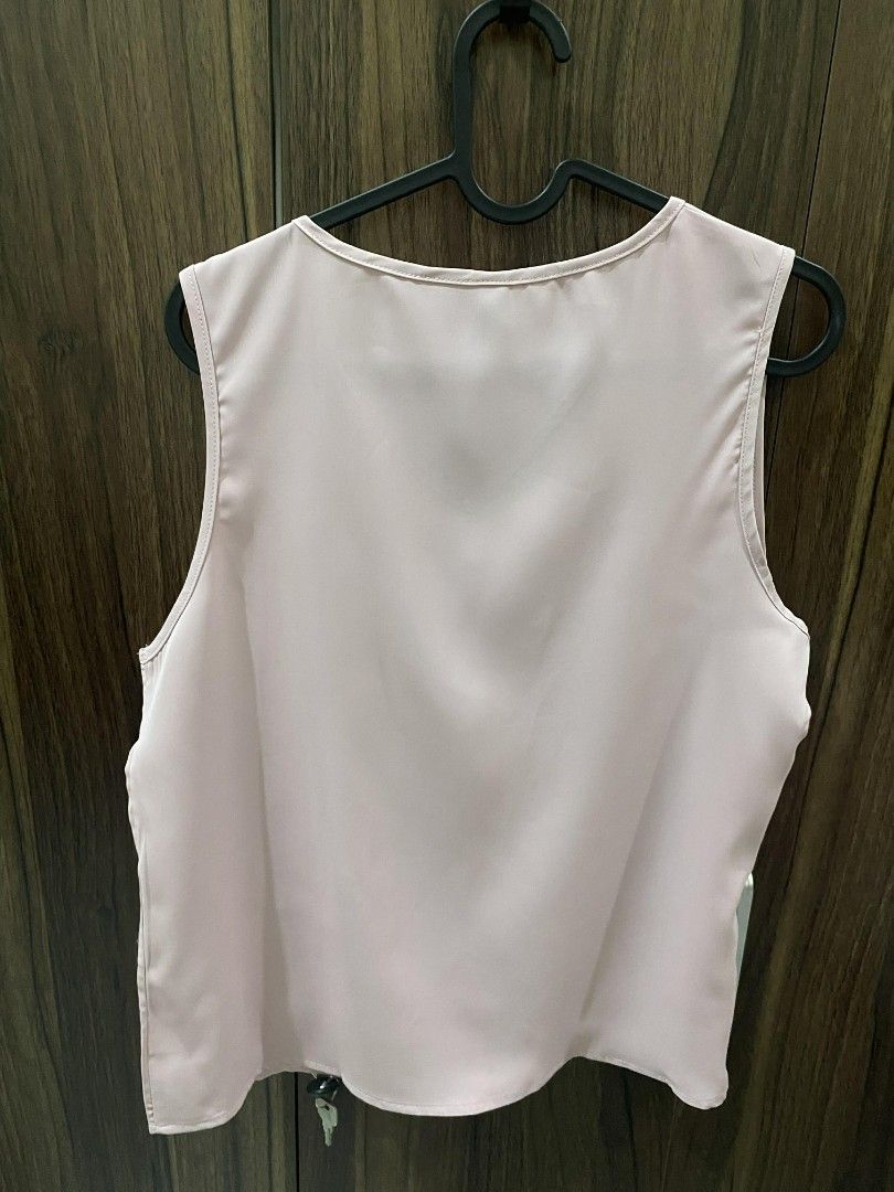 Shein Office V-neck Sleeveless Top (Category: Sleeveless) located in Manila. Submitted by heyzehl (Listing ID 1435892426, Image 2). Description: - Shein V-neck top - Sleeveless design - Light pink color - Size: M (EU 38, US 6) - Made from smooth fabric - Versatile and easy to pair.