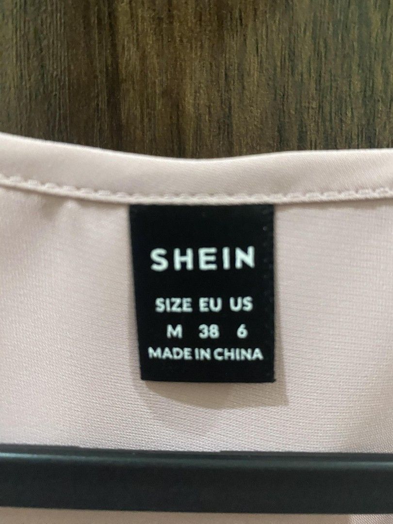 Shein Office V-neck Sleeveless Top (Category: Sleeveless) located in Manila. Submitted by heyzehl (Listing ID 1435892426, Image 3). Description: - Shein V-neck top - Sleeveless design - Light pink color - Size: M (EU 38, US 6) - Made from smooth fabric - Versatile and easy to pair.