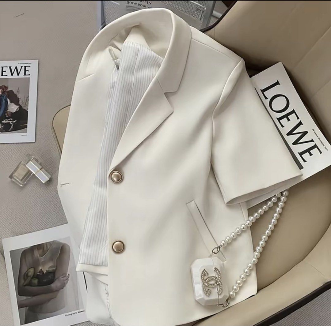 Short Sleeve Blazer from CARINE (Category: Coats, Jackets and Outerwear) located in Mandaluyong City. Submitted by krsch (Listing ID 1435822479, Image 2). Description: Cream-colored blazer from CARINE (tiktok shop). Short sleeves with classic lapel collar, and two front pockets. Striped lining originally bought for 619, UNUSED rfs: di bagay sakin as a broad-shouldered girly.