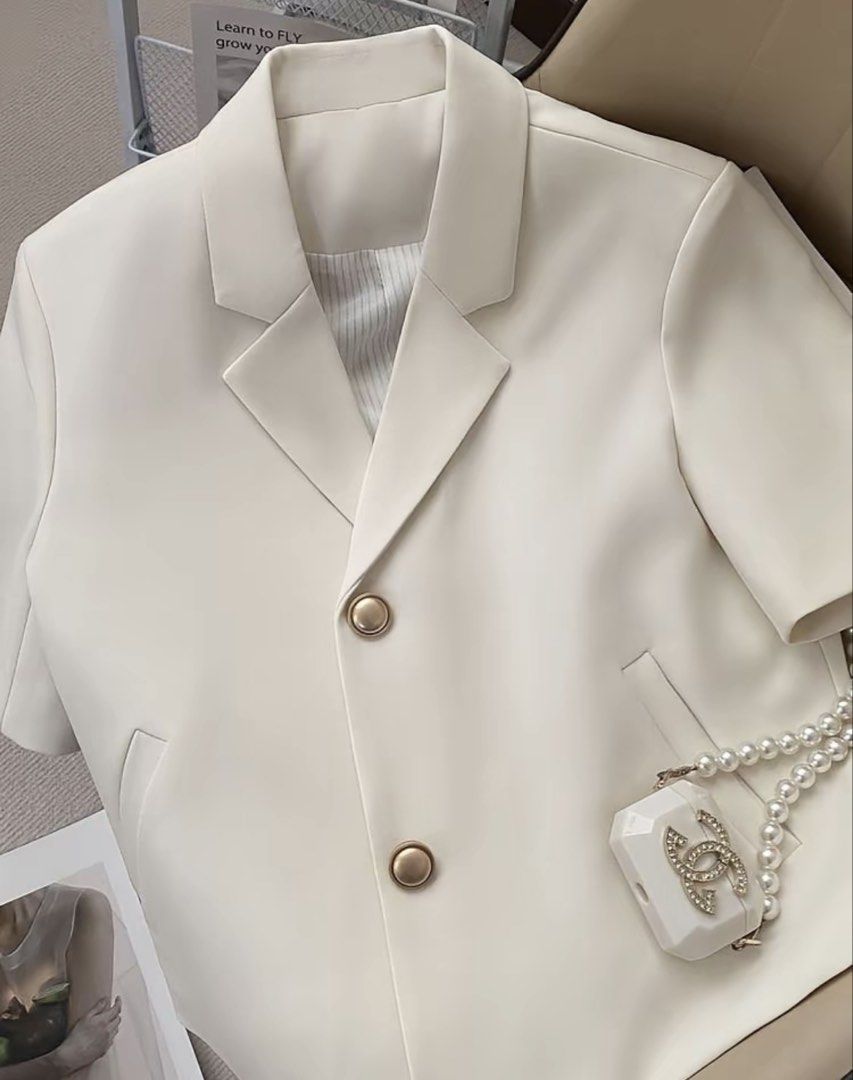 Short Sleeve Blazer from CARINE (Category: Coats, Jackets and Outerwear) located in Mandaluyong City. Submitted by krsch (Listing ID 1435822479, Image 1). Description: Cream-colored blazer from CARINE (tiktok shop). Short sleeves with classic lapel collar, and two front pockets. Striped lining originally bought for 619, UNUSED rfs: di bagay sakin as a broad-shouldered girly.