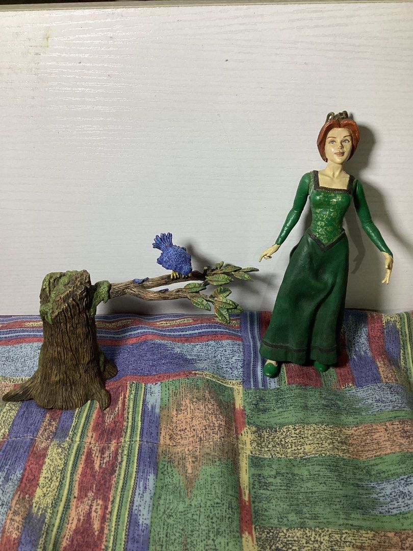 Shrek Princess Fiona Figure (Category: Figurines & Statues) located in Caloocan City. Submitted by lostrtrp (Listing ID 1435773934, Image 1). Description: 2001 McFarlane Figure Kicking Fiona with blue bird.
