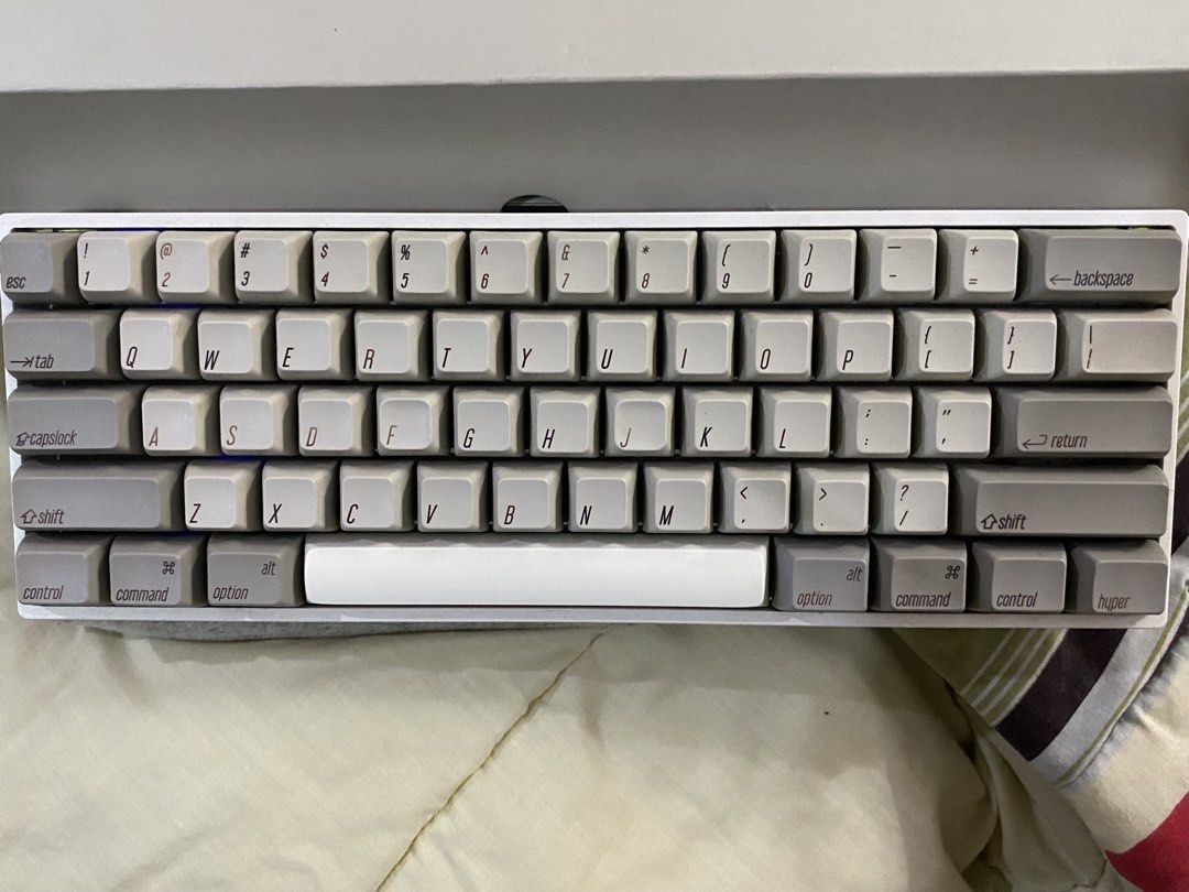 Skyloong GK61S (CUSTOM) mechanical keyboard (Category: Computer Keyboard) located in Manila. Submitted by jii_sels (Listing ID 1435829279, Image 2). Description: Details: -Bought the kit in 2022 from Skyloong official store 🍊app - Gateron Milky Yellow, lubed - Stabs are tuned as well - Generic chinese PBT SA profile keycaps (wasd a bit faded) - Original aluminum plate, foam modded - Supports bluetooth -Issue: missing rubber feet from front side 