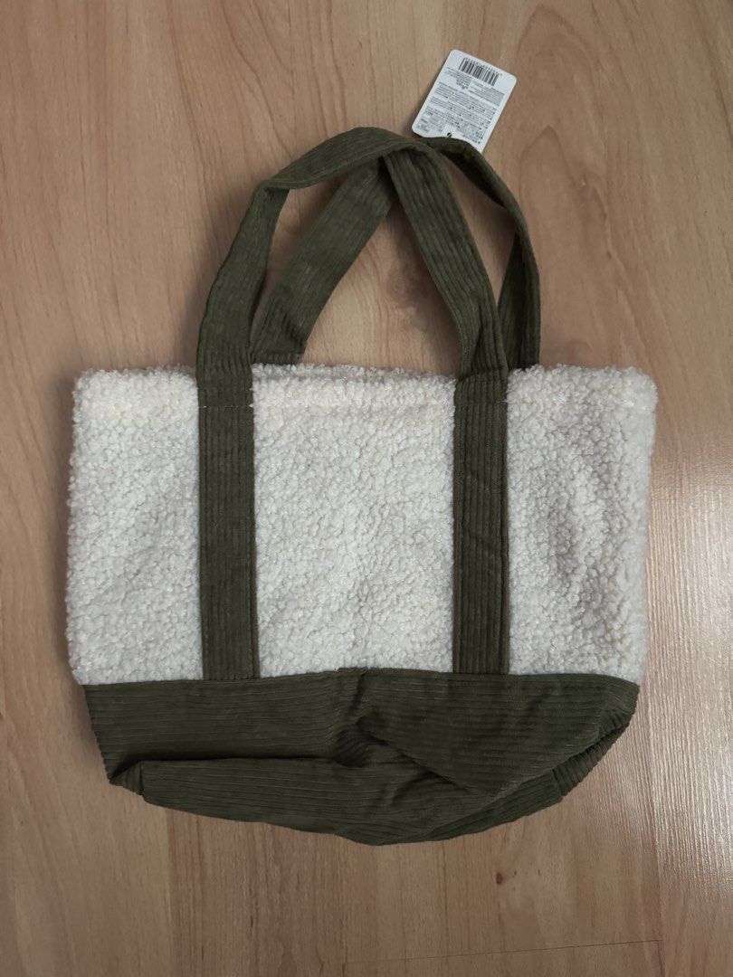 Small Olive Green and White Tote Bag (Category: Tote Bags) located in Manila. Submitted by megimogu (Listing ID 1435745773, Image 2). Description: - Brand new small tote bag - Olive green corduroy and white fluffy material - Purchased from Daiso.