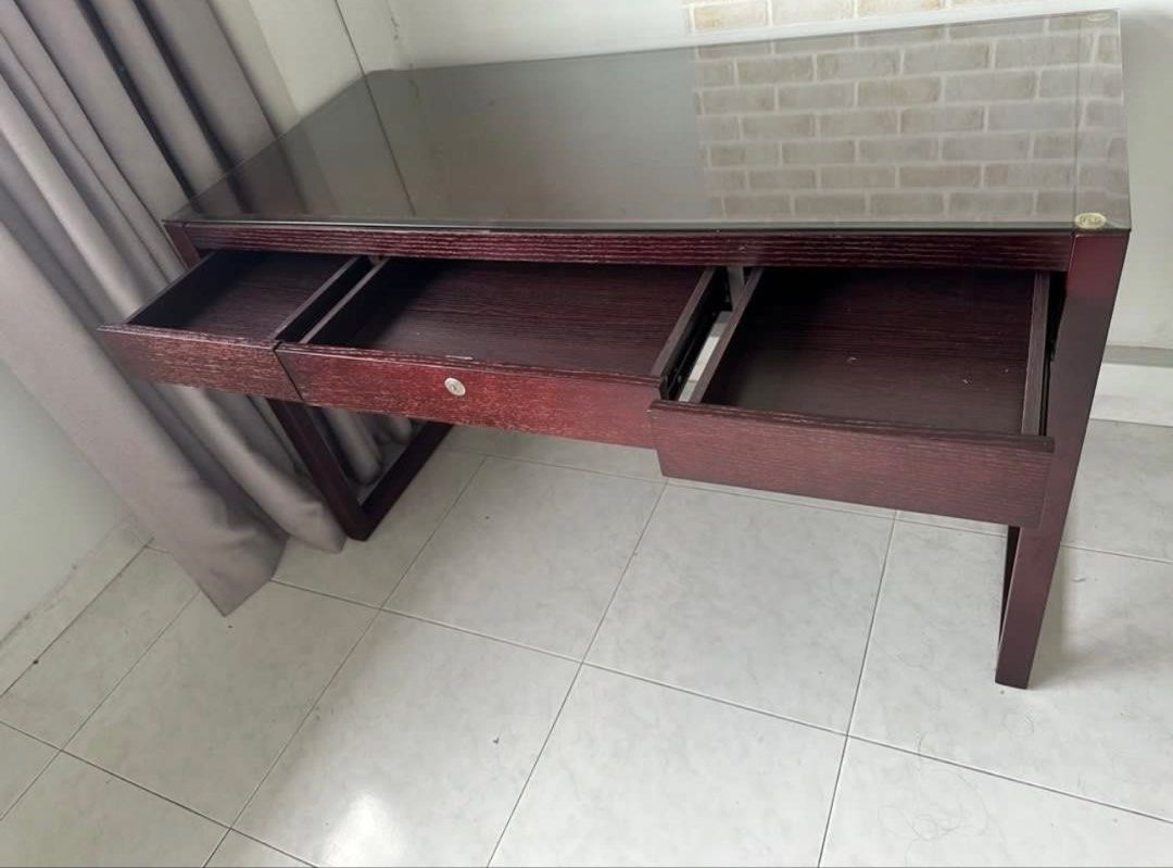 Solid Study table (Category: Tables & Sets) located in Singapore. Submitted by 2hot4u29 (Listing ID 1435855984, Image 2). Description: Study desk table with 3 drawers Customised glass top for table included . Will include one wooden chair Height 75cm Length 125cm Width 58cm $99 Please use own mover or lalamove ..