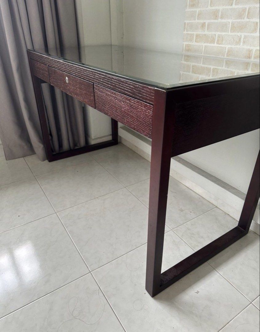 Solid Study table (Category: Tables & Sets) located in Singapore. Submitted by 2hot4u29 (Listing ID 1435855984, Image 1). Description: Study desk table with 3 drawers Customised glass top for table included . Will include one wooden chair Height 75cm Length 125cm Width 58cm $99 Please use own mover or lalamove ..