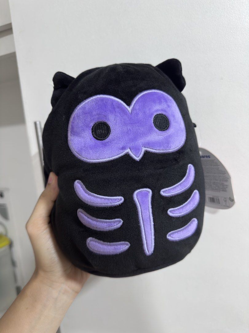 Squishmallows Holly the Owl (Category: Plushies & Soft Toys) located in Rizal. Submitted by GirlDeclutter (Listing ID 1435822302, Image 1). Description: - Squishmallows Holly the Owl plush toy - Features a black body with purple accents - Includes a unique skeleton design - Comes with the original tag - Soft and cuddly material - Perfect for collectors or gifting.