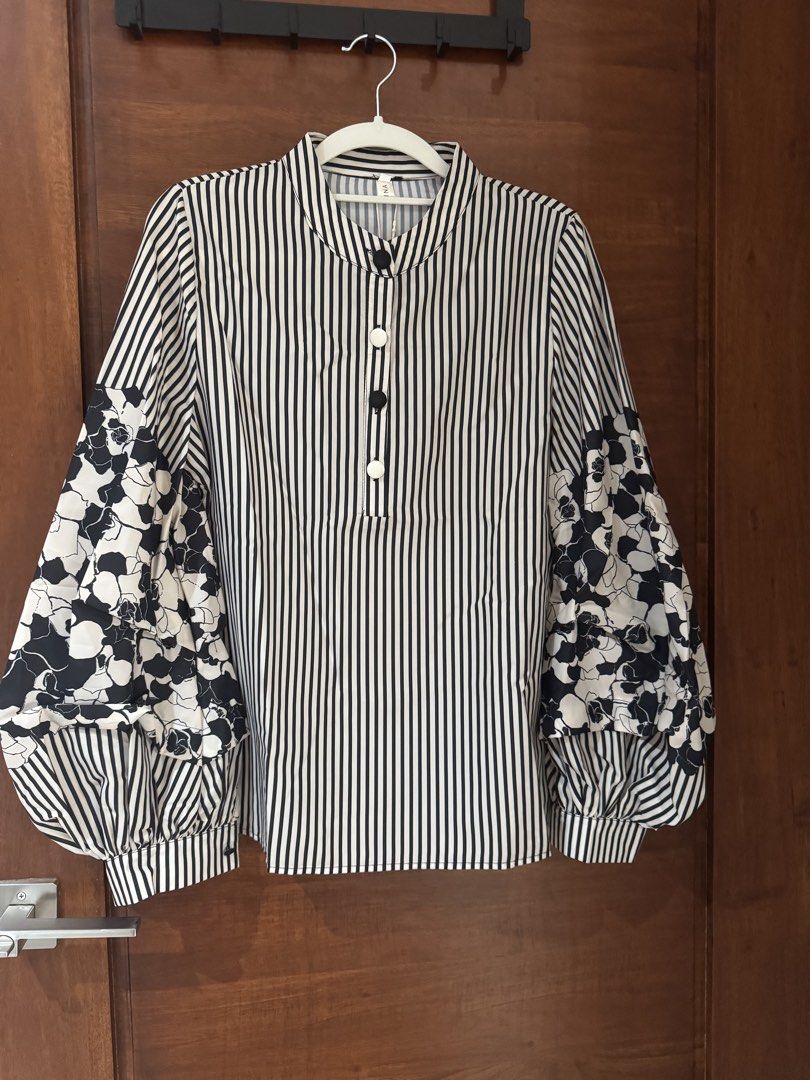 Striped lantern sleeve shirt (Category: Longsleeves) located in Quezon City. Submitted by tinylee60 (Listing ID 1435853467, Image 1). Description: Striped lantern sleeve shirt Size Large Bought aT singapore online shop Rfs size too small.