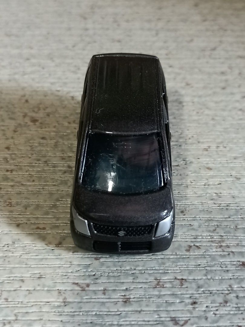 Suzuki Wagon R Toy Car (Category: Vehicle & Diecast Models) located in Quezon City. Submitted by Bernz (Listing ID 1435766778, Image 1). Description: - Detailed Suzuki Wagon R toy car. - Features a detailed front grill and headlights. - Includes rear tail lights. - Trunk can be opened. - Has four wheels. - Likely made of diecast metal or plastic. - Miniature replica of the real Suzuki Wagon R..