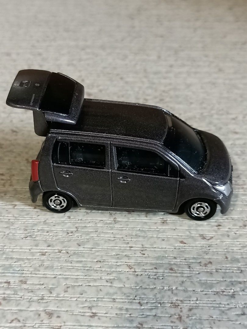 Suzuki Wagon R Toy Car (Category: Vehicle & Diecast Models) located in Quezon City. Submitted by Bernz (Listing ID 1435766778, Image 3). Description: - Detailed Suzuki Wagon R toy car. - Features a detailed front grill and headlights. - Includes rear tail lights. - Trunk can be opened. - Has four wheels. - Likely made of diecast metal or plastic. - Miniature replica of the real Suzuki Wagon R..