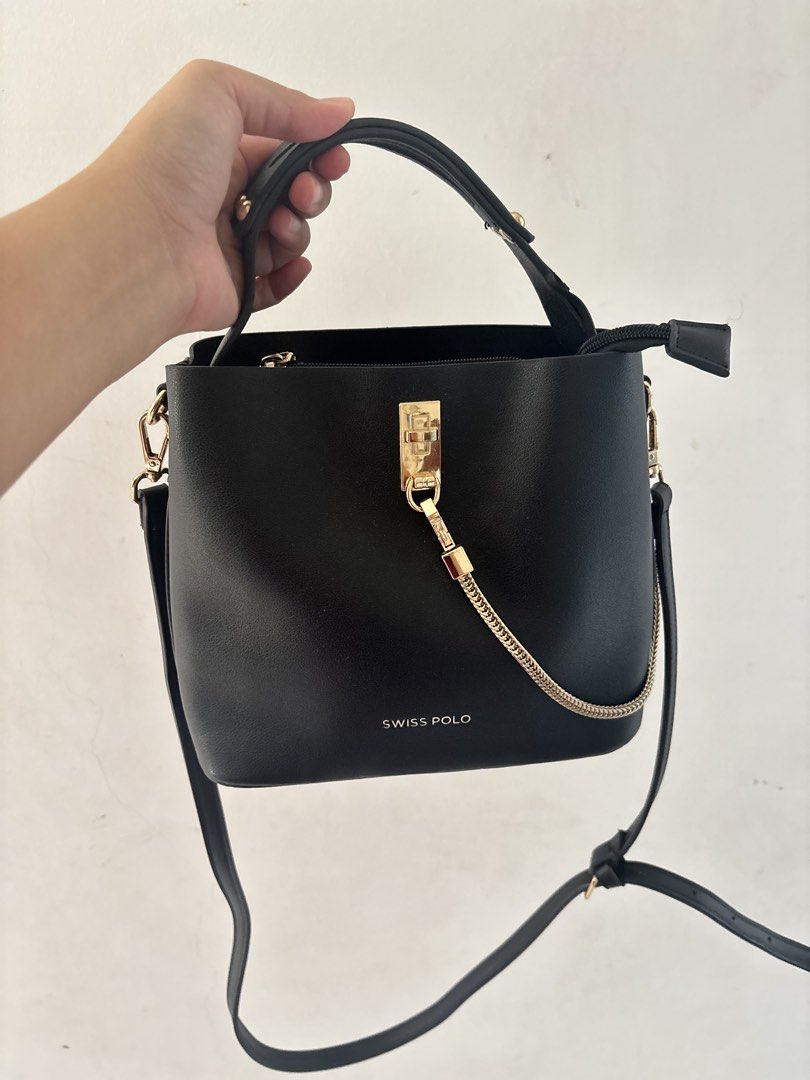 Swiss Polo Black Bucket Bag (Category: Shoulder Bags) located in Bulacan. Submitted by mreyes21 (Listing ID 1435775493, Image 2). Description: - Swiss Polo black bucket bag - Top handle and detachable shoulder strap - Gold-toned chain detail and hardware - Zippered main compartment - Exterior pocket - Interior small zippered pocket - Magnetic snap closure.