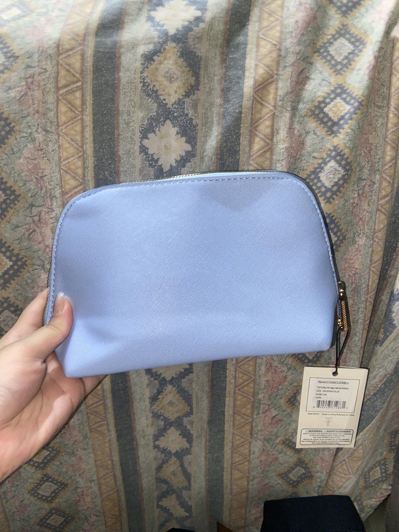 Ted Baker London Cosmetic Bag (Category: Luxury Bags & Wallets) located in San Pedro. Submitted by bellyellie9 (Listing ID 1435824882, Image 2). Description: - Ted Baker London cosmetic bag - Light blue color - Floral interior - Gold zipper - Includes two small travel bottles - Comes with silica gel packets.