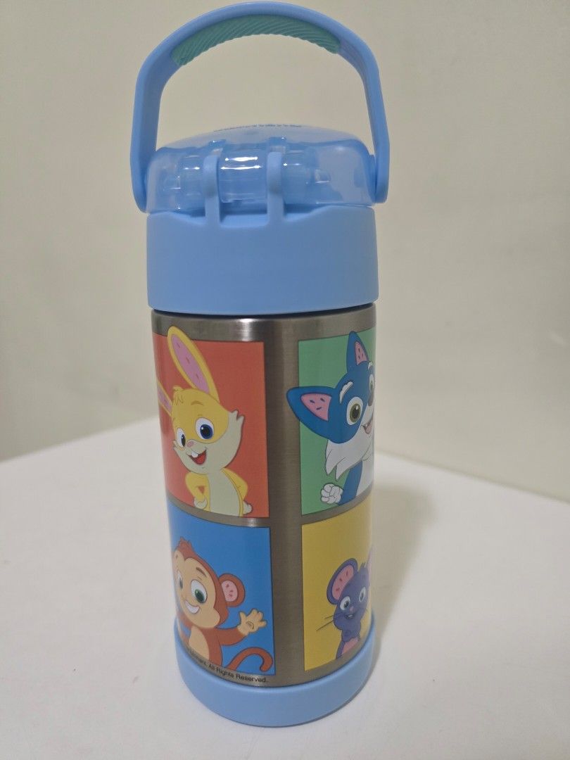 Thermos Cocomelon Kids Straw Water Bottle 12oz (Category: Weaning & Toddler Feeding) located in Santa Rosa. Submitted by analynlacson (Listing ID 1435714708, Image 3). Description: - Cocomelon-themed water bottle. - Features a blue design with colorful Cocomelon characters. - Includes a convenient handle for easy carrying. - Has a flip-top spout for easy drinking. - Made of stainless steel. - Designed to keep drinks cold..