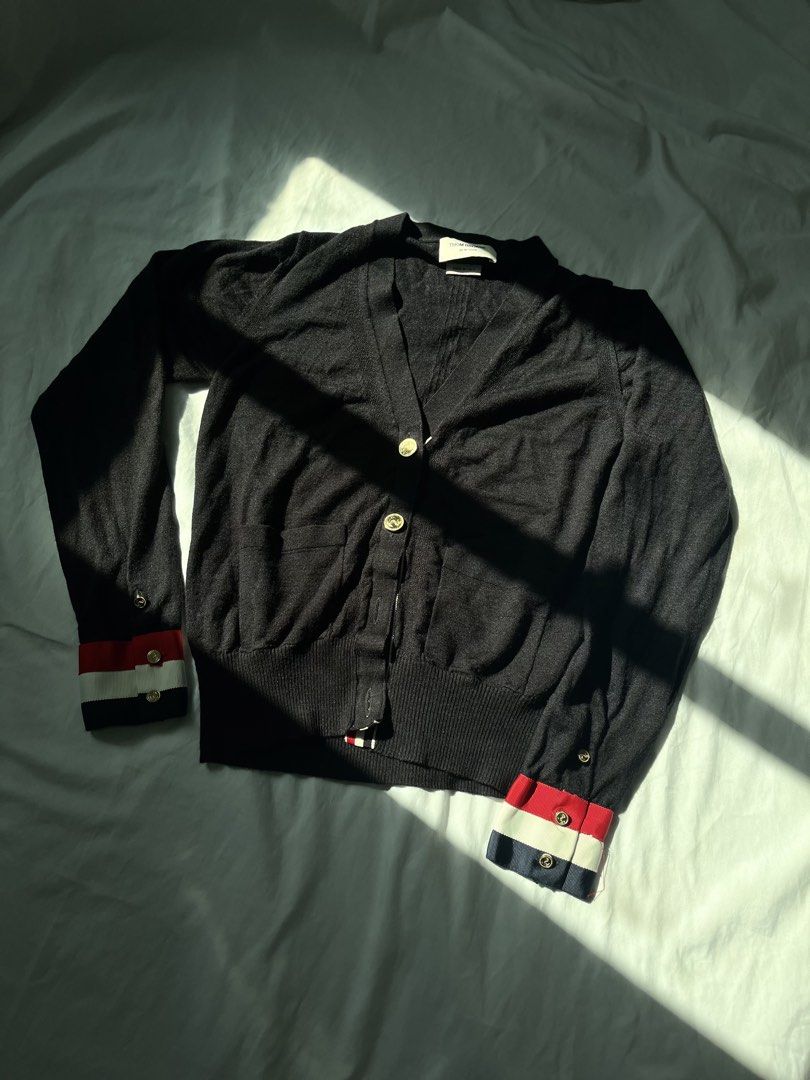 Thom browne Grossgrain cuff wool cardigan (Category: Luxury Apparel) located in Taguig. Submitted by maniladept. (Listing ID 1435790454, Image 1). Description: Thom browne Grossgrain cuff wool cardigan ACCURATE CODE WOOL MATERIAL SIZE:38/0 MISSING ONE BUTTON 9/10 CONDITION NEGOTIABLE DM.