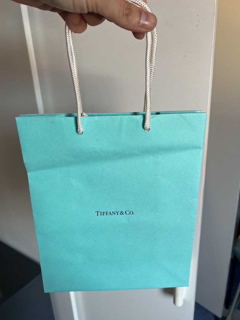 Tiffany & Co. Paper Bag (Category: Luxury Bags & Wallets) located in Makati City. Submitted by marckyboy (Listing ID 1435815355, Image 1). Description: - Authentic Tiffany & Co. paper bag - Classic Tiffany blue color - Features the Tiffany & Co. logo - Includes white rope handles - Reusable and recyclable.