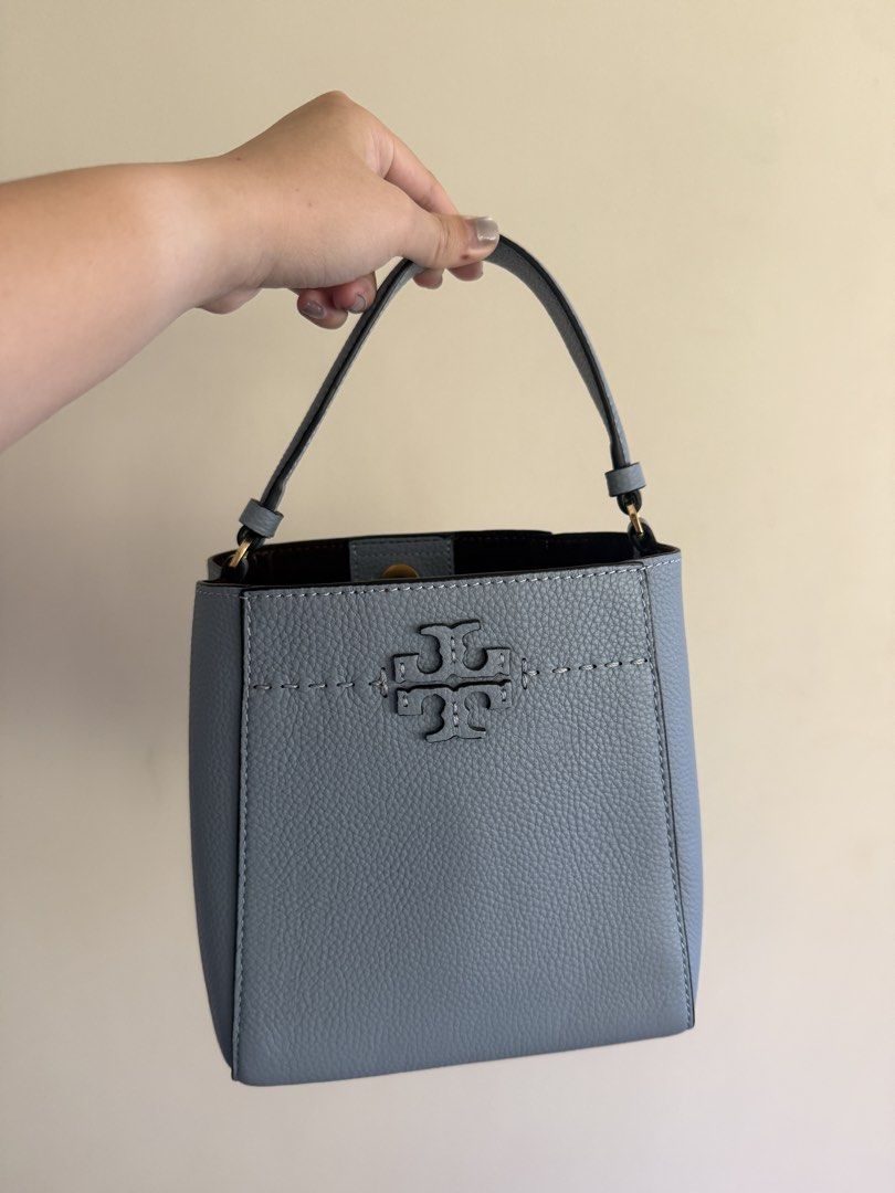 Tory Burch Bucket Bag (Category: Luxury Bags & Wallets) located in Cebu City. Submitted by karenm14 (Listing ID 1435747009, Image 1). Description: - Tory Burch bucket bag - Light blue exterior - Top handle - Stitched design - Magnetic closure - Interior pocket - Detachable strap.