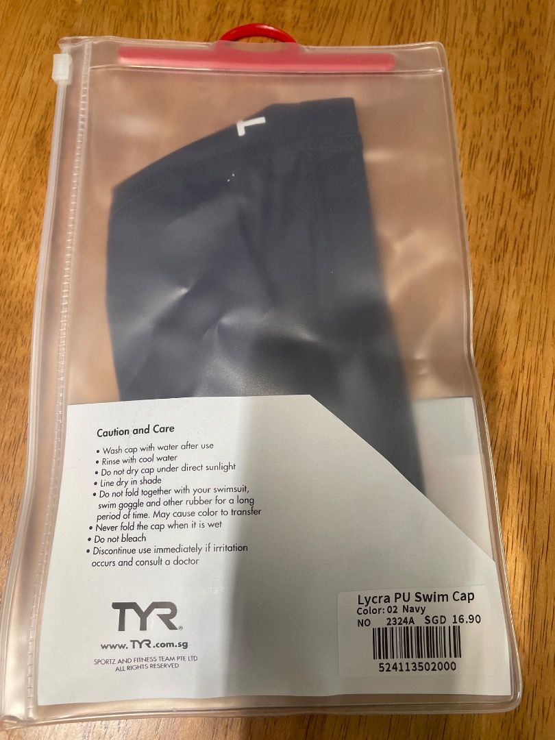 TYR Lycra PU Swim Cap - Navy (Category: Water Sports) located in Singapore. Submitted by rayli_1 (Listing ID 1435793028, Image 2). Description: - Brand new TYR Lycra PU swim cap - Navy color - Comes in original packaging - Includes care instructions - Ideal for swimming and water activities - One Size.