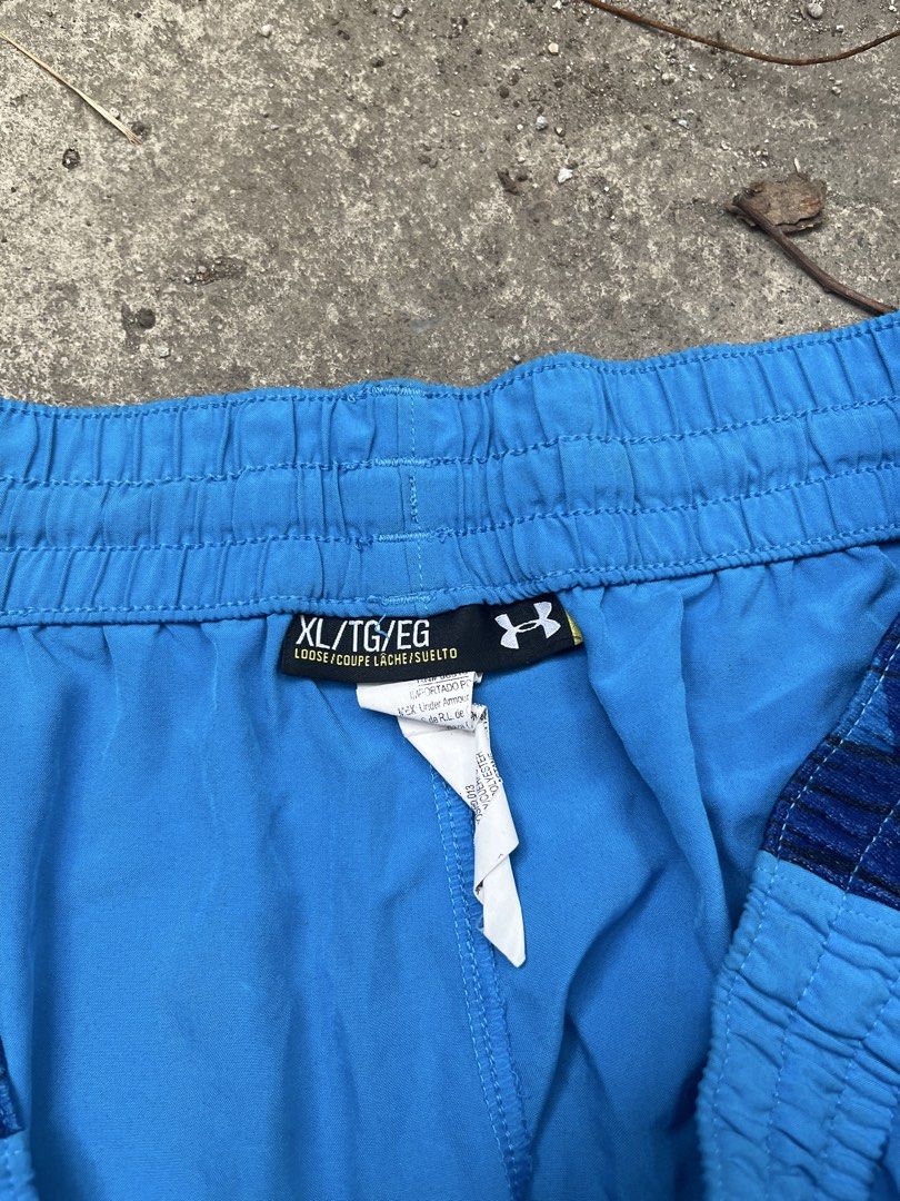 Under Armour Blue Shorts XL (Category: Shorts) located in Caloocan City. Submitted by jerichotad22965 (Listing ID 1435795143, Image 2). Description: - Under Armour blue shorts - Size: XL/TG/EG - Features: - Drawstring waist - Blue and navy pattern - Under Armour logo - Material: Lightweight - Suitable for: Sports or casual wear -Issue Fade Print .