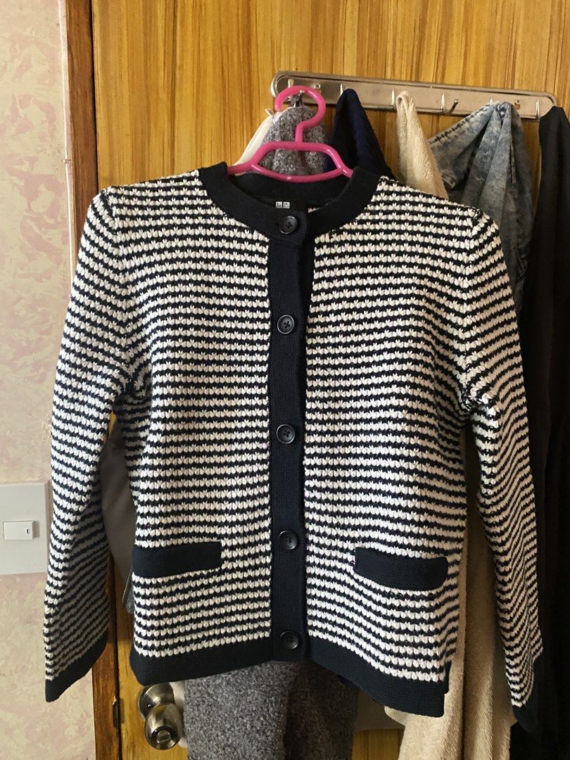 Uniqlo Striped Cardigan (Category: Coats, Jackets and Outerwear) located in Santa Maria. Submitted by mauicart (Listing ID 1435781888, Image 1). Description: - Once used - Uniqlo striped cardigan - Classic design with round neckline - Button-down closure - Features two front pockets - Navy blue trim - Made of a knit material - Perfect for layering - Versatile for various outfits.