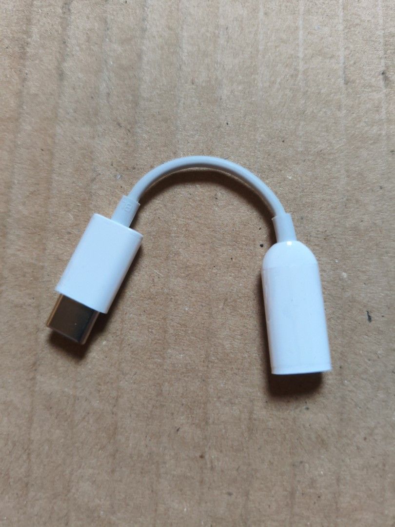 USB-C to 3.5mm Headphone Jack Adapter (Category: Cables & Adaptors) located in Pasig City. Submitted by coolphoenix-29ac (Listing ID 1435810509, Image 2). Description: - Connects 3.5mm headphones to USB-C devices. - Features a sleek white finish. - Includes a short, flexible cable for convenience. - Compact and portable design. - Specifically for audio output. - Compatible with various USB-C devices..
