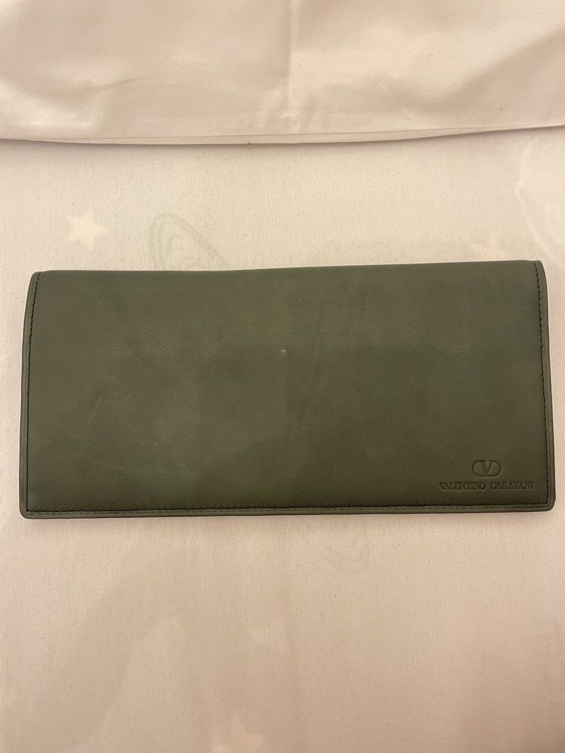 Valentino Garavani Long Wallet (Category: Luxury Bags & Wallets) located in Marilao. Submitted by wardrovearchives (Listing ID 1435910880, Image 2). Description: - Valentino Garavani long wallet - Green leather exterior -Almost new, Soft leather - Features the Valentino Garavani logo - Interior with multiple card slots - Includes a zippered compartment - Zipper pull engraved with the brand name - Includes a T. Ishii (Most likely pernal stamp).