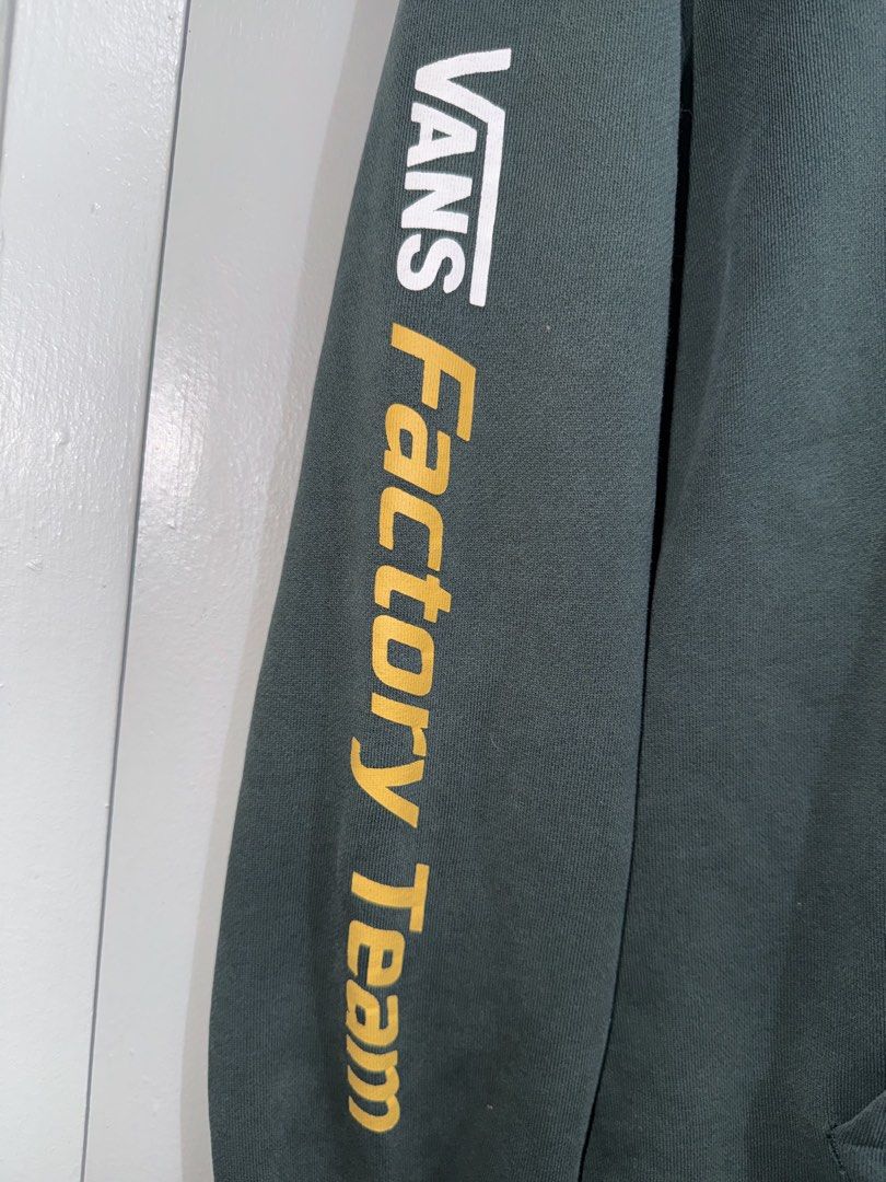 Vans Factory Team Hoodie (Category: Hoodies) located in Quezon City. Submitted by sabbyfinds (Listing ID 1435763235, Image 3). Description: 🔍 Manage Expectations All items are thrifted/own preloved. Expect minimal signs of use. ALL POSTED PICTURES ARE TRUE TO ITS COLOR AND FLAWS - Vans Factory Team Hoodie - Green color, Features the Vans logo on the front,Factory Team design on the sleeve - size - W: 21 in L:23 inches - With hairline on the prin