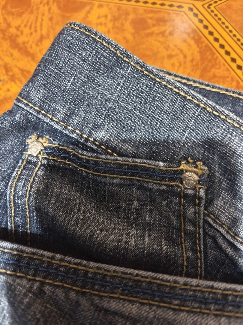 Versace Jeans Couture Denim Jeans (Category: Jeans) located in Sogod. Submitted by engr.thrift.22 (Listing ID 1435863569, Image 3). Description: - Authentic Versace Jeans Couture - Denim blue color - Versace logo button closure - Unique back pocket design - Visible stitching.