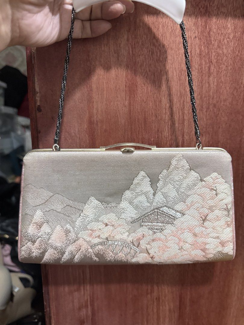 Vintage Embroidered Clutch Bag (Category: Clutches) located in Manila. Submitted by eicho (Listing ID 1435857340, Image 2). Description: - Vintage clutch bag - Embroidered landscape design - Beaded chain strap - Clasp closure - Multiple interior compartments - Subtle sheen exterior - Design features mountains and a traditional building - Clasp shows some wear.