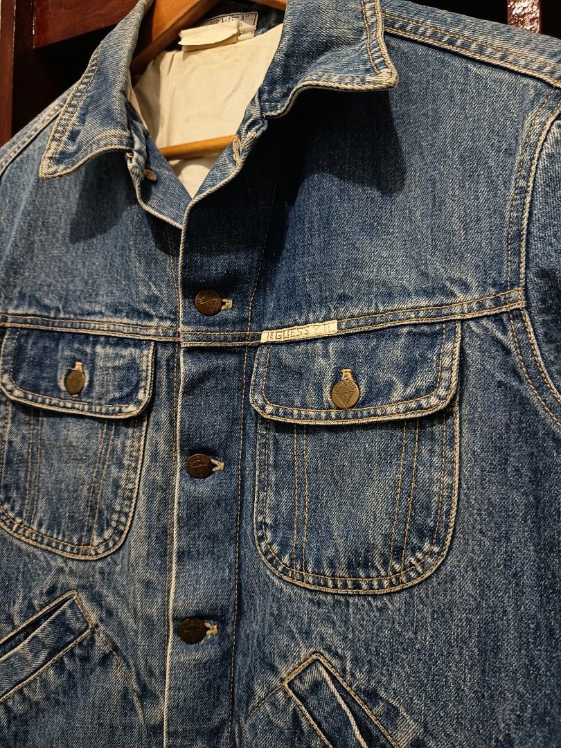 Vintage Guess Denim Trucker Logo Jacket (Category: Coats, Jackets and Outerwear) located in Dagupan City. Submitted by plugofallthreads (Listing ID 1435901714, Image 3). Description: Vintage Guess Denim Trucker Logo Jacket Made in USA Size: Men's Small Length: 25 inches Width: 22 inches Sleeve Length: 29 inches Price: Php 1,500 plus sf DM TO PURCHASE.
