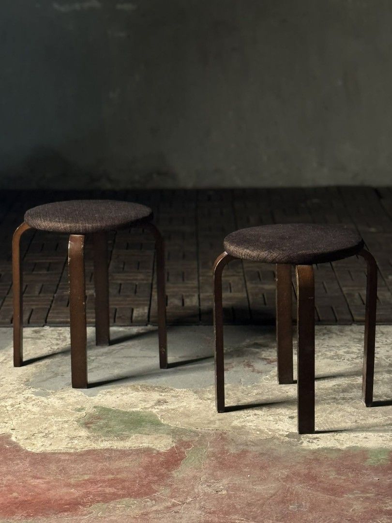 Wooden Stools with Brown Cushions (Category: Chairs) located in Valenzuela. Submitted by upcycle_things (Listing ID 1435734144, Image 3). Description: - Set of two wooden stools - Round, brown cushioned seats - Dark brown, curved wooden frame - Sturdy and functional design - Suitable for seating - Versatile for various spaces.