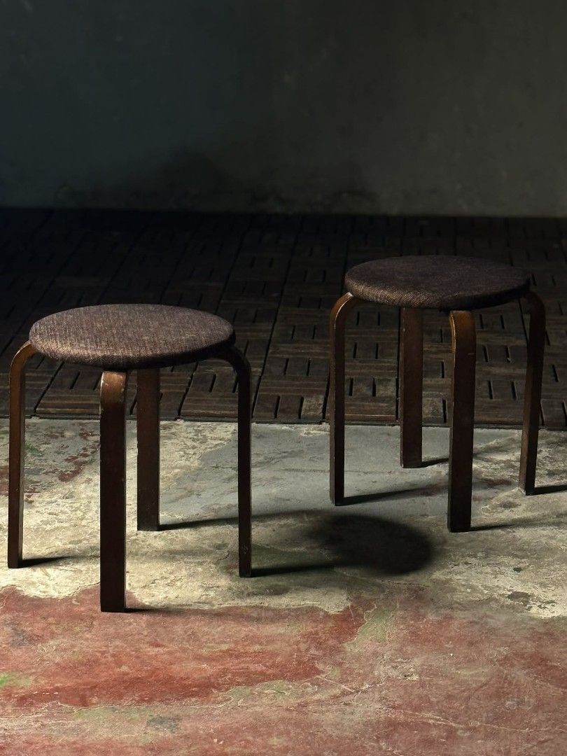 Wooden Stools with Brown Cushions (Category: Chairs) located in Valenzuela. Submitted by upcycle_things (Listing ID 1435734144, Image 1). Description: - Set of two wooden stools - Round, brown cushioned seats - Dark brown, curved wooden frame - Sturdy and functional design - Suitable for seating - Versatile for various spaces.