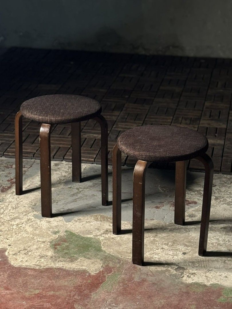 Wooden Stools with Brown Cushions (Category: Chairs) located in Valenzuela. Submitted by upcycle_things (Listing ID 1435734144, Image 2). Description: - Set of two wooden stools - Round, brown cushioned seats - Dark brown, curved wooden frame - Sturdy and functional design - Suitable for seating - Versatile for various spaces.