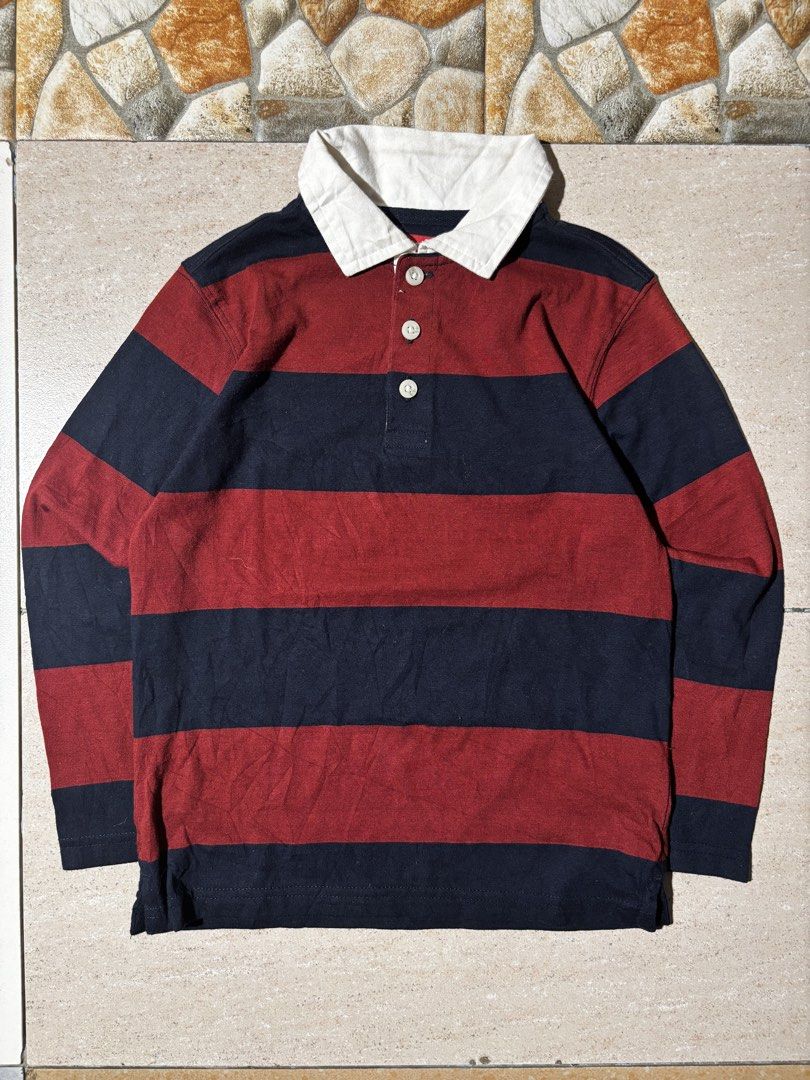 Wrangler Striped Rugby Shirt (Category: Tshirts & Polo Shirts ) located in Paranaque City. Submitted by coveredtags (Listing ID 1435715760, Image 2). Description: - Wrangler rugby shirt - Size: S - Color: Navy and maroon stripes - Features a white collar and button-up placket - Made in India - Material: Cotton and polyester blend - Style: Long-sleeved, casual wear.