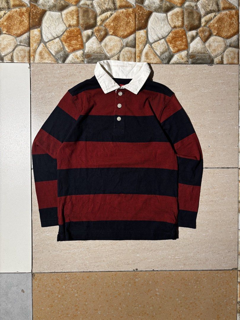 Wrangler Striped Rugby Shirt (Category: Tshirts & Polo Shirts ) located in Paranaque City. Submitted by coveredtags (Listing ID 1435715760, Image 1). Description: - Wrangler rugby shirt - Size: S - Color: Navy and maroon stripes - Features a white collar and button-up placket - Made in India - Material: Cotton and polyester blend - Style: Long-sleeved, casual wear.