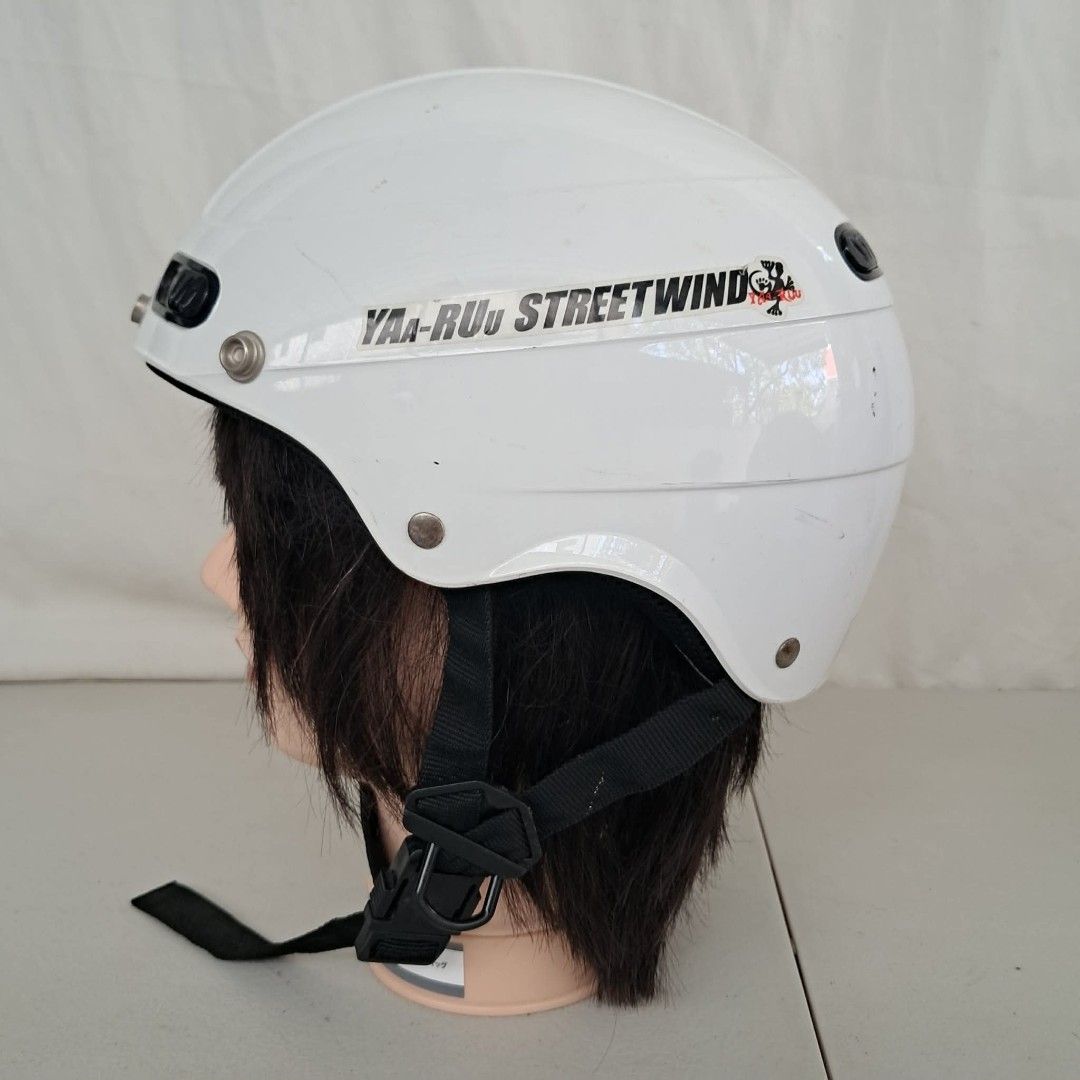 Yaa-Ruu Streetwind Motorcycle Helmet (Category: Caps & Hats) located in Bulacan. Submitted by amarijapansurplus (Listing ID 1435720335, Image 2). Description: - White motorcycle helmet - Features the 'Yaa-Ruu Streetwind' logo - Glossy finish - Equipped with ventilation ports - Includes a chin strap - Comes with a sticker.