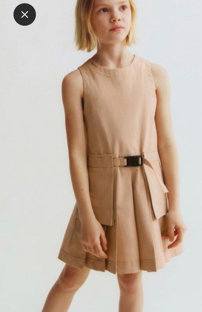 Zara Beige Pleated Dress (Category: Babies & Kids Fashion) located in Manila. Submitted by hrh123 (Listing ID 1435911682, Image 1). Description: Original Zara Zara Kids Dress. Size: Size 7 ( 122cm) very cute and classy worn only a few times my child is now 9yrs old di na kasya No flaws. Maganda pa din .